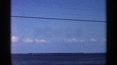 1966: a ocean with full of water and it looks like blueprint and sky with clouds