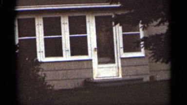 1965: house with what seems to be a figure standing at the door. DULUTH