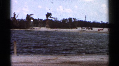 1966: people enjoy the warm weather on the opposite shore of a lake FLORIDA
