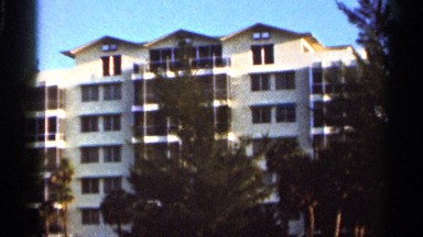 1966: view of an eight story building with the sun shining upon the window