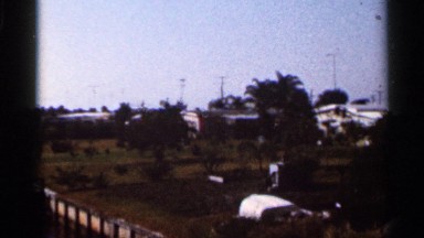 1966: small community on a summer day with hot and dry fields in the distance