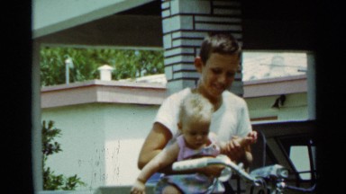 1963: Boy Holds and Plays with His Little Brother