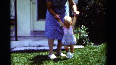 1963: the small kids to training to walk our grand mother in our garden