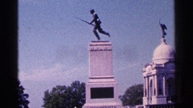1964: a landscaped area shows two edifices with statuary on them. PENNSYLVANIA