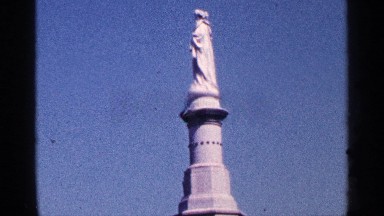 1964: elegant statue of a woman that stands above everything else