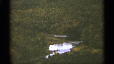 1965: dense forests surround pools of water flowing through the mountains DULUTH
