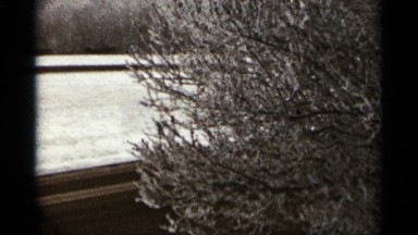 1965: a flatbed truck drives down a highway after a snowfall on a windy day