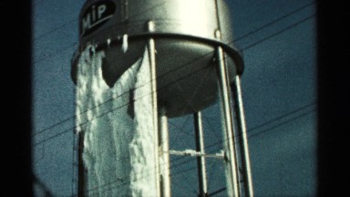 1965: old water tower, with solid ice down the side, caused by a leak. DULUTH