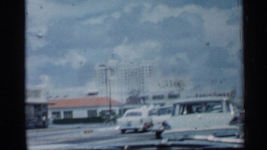 1958: driving past city buildings labeled "cuba" and "coca-cola" FLORIDA