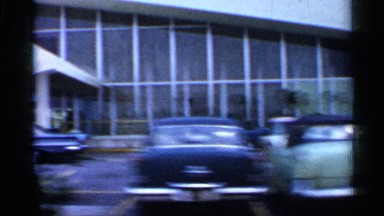 1958: slow drive in the car watch the near buildings and car bike morning time