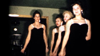1958: a home interior showcases four women as they perform, swinging arms