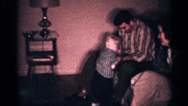 1958: a father played in our son near to mother and another son sits