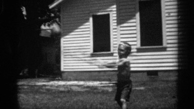 1958: A Little Boy Trying to Hit a Ball with a Bat in His Backyard New Jersey