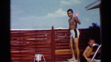 1963: Boy Jumping Off Diving Board Into Pool Mississippi