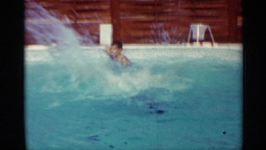 1963: two boys swimming and playing in a backyard swimming pool MISSISSIPPI