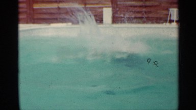 1963: a kid jumped into the water and swim like an expert in the swimming pool