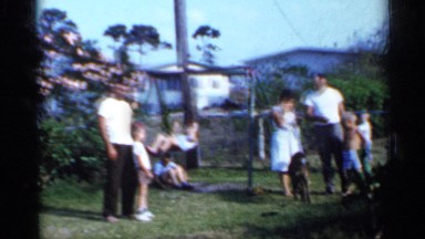 1958: family enjoying a warm, sunny day in their backyard FLORIDA