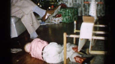1959: a beautiful small boy lay down below their father foot MICHIGAN