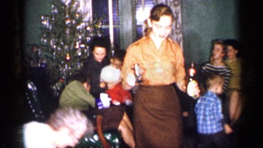 1959: joyous people enjoying a christmas party at home with family MICHIGAN