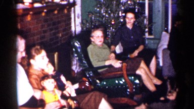 1959: people are talking at the house and some kids also there and a man keeping