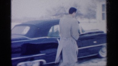 1959: a man walk go car another side door open sit in the car morning time blue