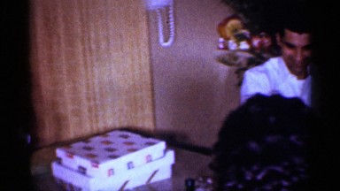 1959: party of friends gathered in table,enjoying eat with her mom MICHIGAN