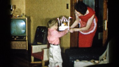 1959: a birthday carousel cake extravaganza, child nervous to handle such a cake