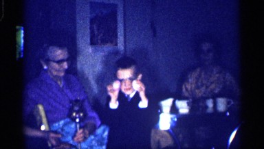 1959: a small boy watch the sweet near grand mother and mother in a home