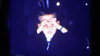 1959: boy receives present, smiles and takes his new gift, plays for the camera