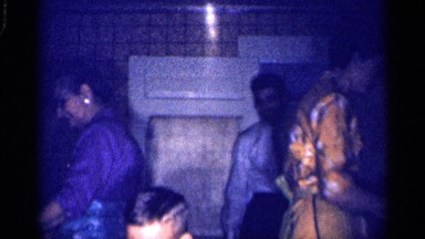 1959: two ladies are cooking the man watching that and the baby is playing