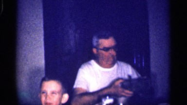 1959: a family scenario, grandparents and grandchildren enjoying with guests