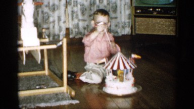 1959: little boy playing with carnival toy MICHIGAN