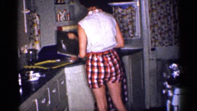 1959: two beautiful girls are dressed in shorts and checked dress