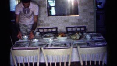 1959: a women arrange for the food eating table plate, vintage clip