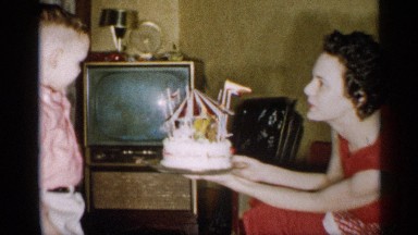 1959: mom show her son his birthday cake MICHIGAN
