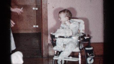 1955: A Young Baby Boy Enjoys Time With His Mother in the Kitchen, New York