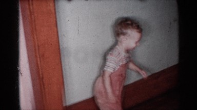 1955: a small children run the our father sit in the our place near another