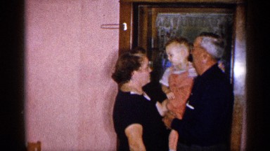 1955: a beautiful kiss by a baby. NEW YORK