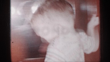 1955: a boy running and touched his grandfather and enjoying with their house