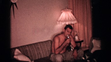 1958: kid plays in home with dad FLORIDA