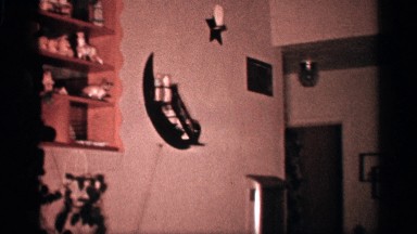 1958: panning footage of a child playing in a living room. FLORIDA