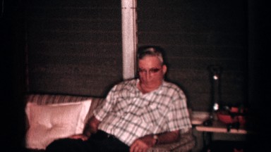 1958: interior with comfortable furniture, older adults and rambunctious