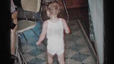 1955: young child in the kitchen being curious NEW YORK