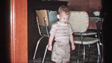 1955: the boy is laughing near of his parents it so exciting and joy to happy