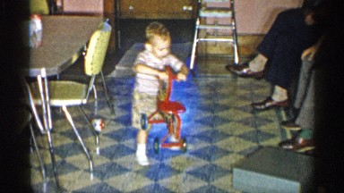 1955: the boy playing so toys and so enjoy very much in front of his parents