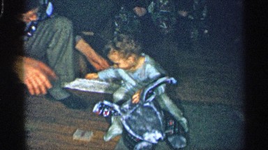1955: A Little Kids Sit in the Doll Smile to Another Person Near for Men