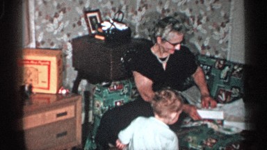 1955: a grand mom trying out a white skirt and feeling happy about it