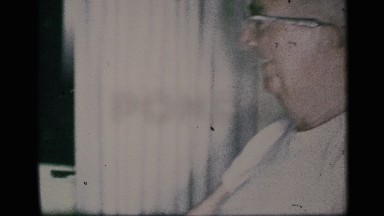 1959: a man laughs at grandson dancing beside a christmas tree NEW YORK