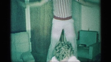 1959: a small boy and young men dance for the our house happy back side wall