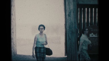 1959: group of adults and children walking to and up stairs on a beach NEW YORK